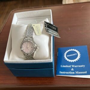 NWT Seiko Silver and Pink Dial Watch ref. SXDF13P1. NEEDS A BATTERY!!
